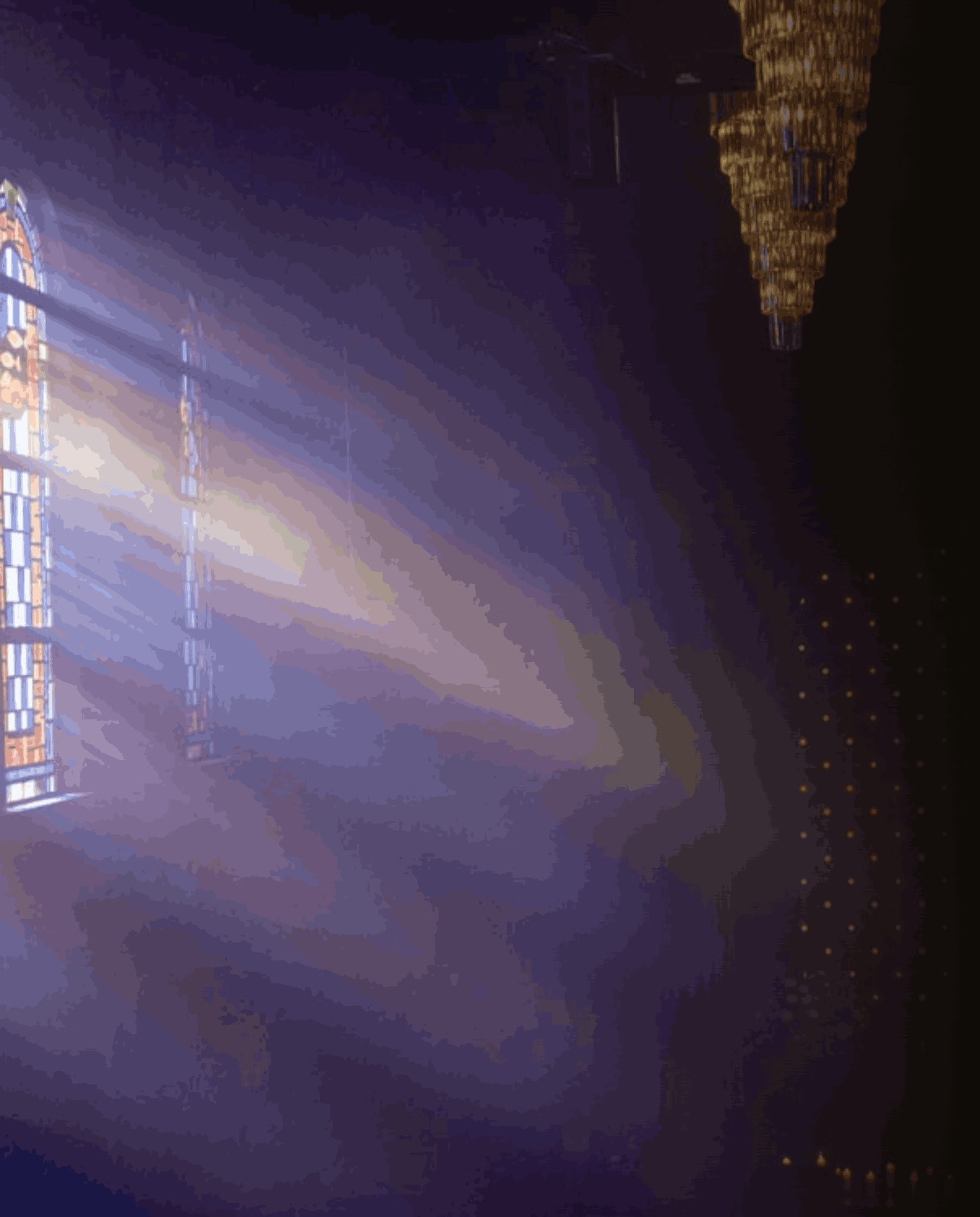 Inside the hall &mdash; stained glass and crystal chandeliers